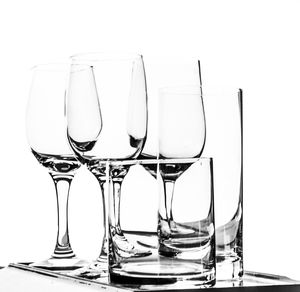 Close-up of wineglass on white background