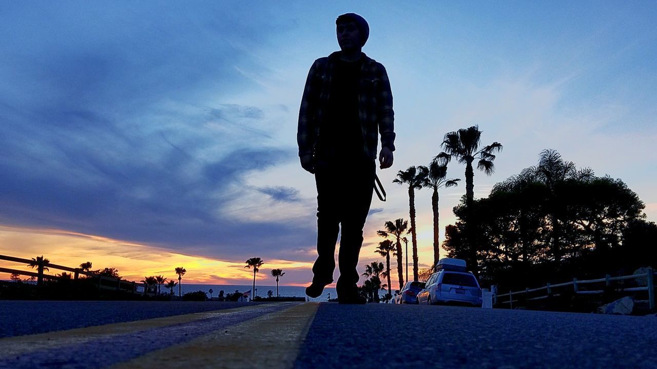 SILHOUETTE MAN ON ROAD AGAINST SKY