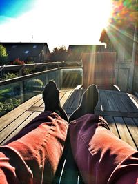 Low section of man sitting outdoors