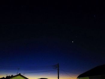 Low angle view of moon against sky at night