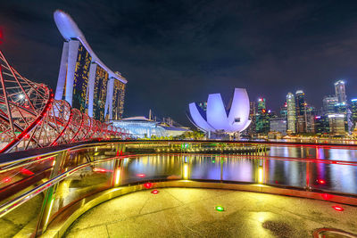 Illuminated city buildings at night