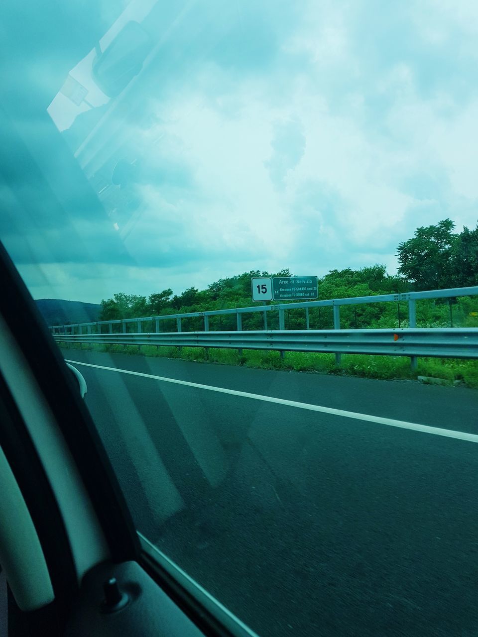 VIEW OF ROAD THROUGH CAR WINDOW