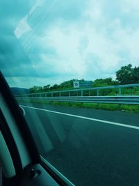 Road seen through car window