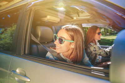 Portrait of woman sitting in car