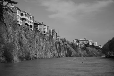 Panoramic view of sea and buildings against sky