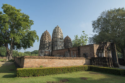 View of temple against building