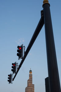 Low angle view of road sign against sky