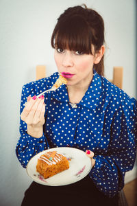 Close-up of young woman holding ice cream