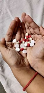 Close-up of person holding pills