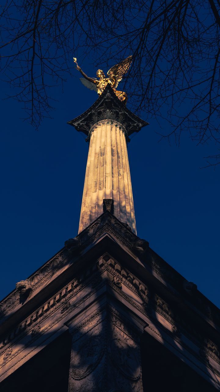 LOW ANGLE VIEW OF A STATUE OF A BUILDING