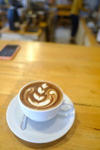 Coffee cup on table