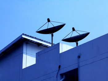 Low angle view of built structure against clear blue sky