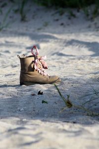 High angle view of boots on sand