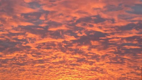 Low angle view of dramatic sky during sunset