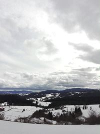 Scenic view of mountains against sky during winter