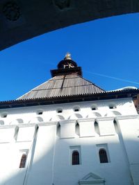 Low angle view of building against clear blue sky