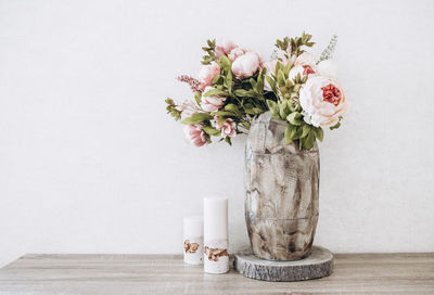 Home decor vase with candle flowers and basket