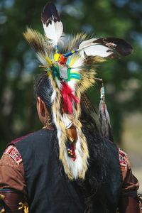 Rear view of man wearing tribal headwear