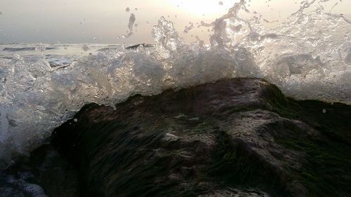 Close-up of water splashing on rocks