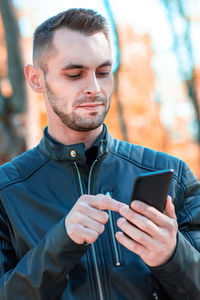 Young man using mobile phone