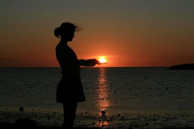 Scenic view of sea at sunset