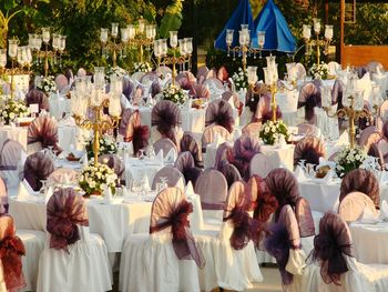 High angle view of covered table and chairs at wedding