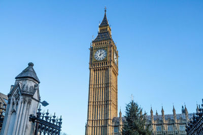 Low angle view of clock tower against sky