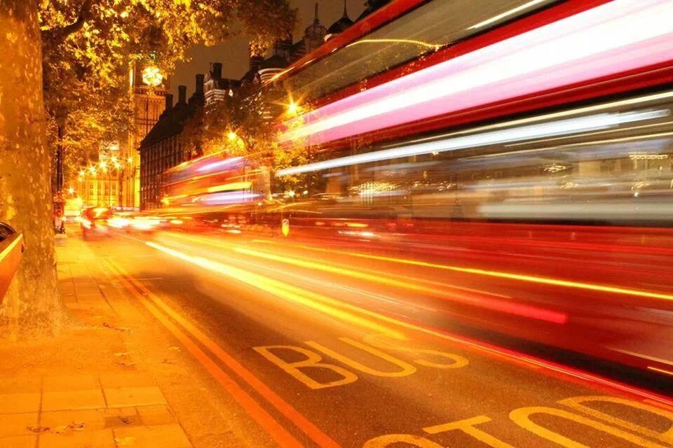 LIGHT TRAILS ON ROAD AT NIGHT