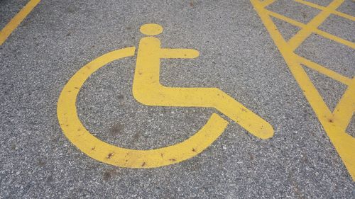 High angle view of road sign on parking lot