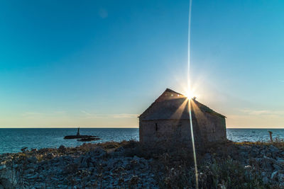 Scenic view of sea against blue sky