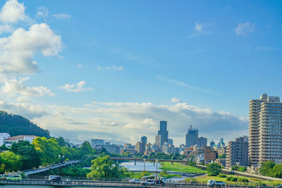 Modern buildings in city against sky