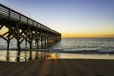 Scenic view of sea against clear sky during sunset