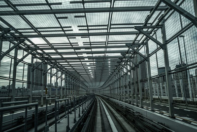 Railroad tracks seen through glass ceiling