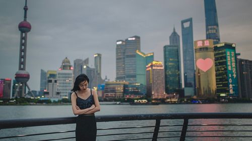 Woman standing in city