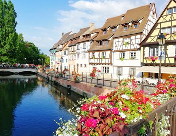 View of canal amidst buildings