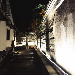 Narrow alley amidst buildings in city