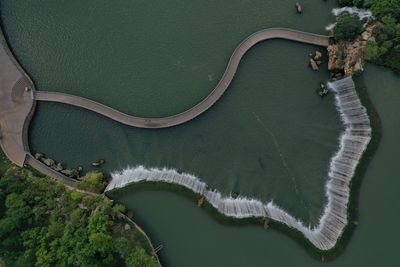 Aerial 360 view of the kunming waterfall park at sunset