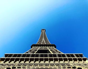 Low angle view of historical building against blue sky