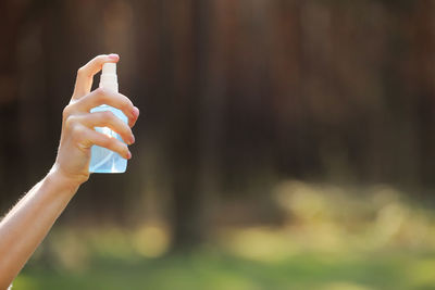 Cropped hand of woman holding toy