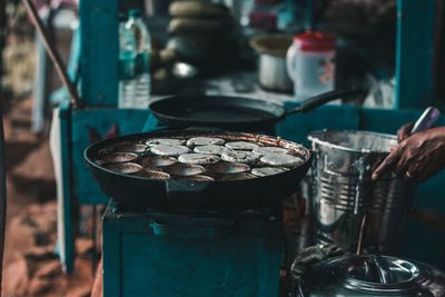 Cropped image of hand preparing food at market