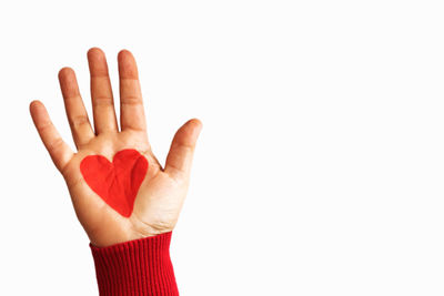 Close-up of human hand against white background