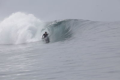 Man surfing on sea