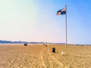 Built structure on beach against sky