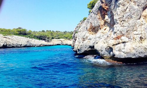 Scenic view of sea against clear blue sky