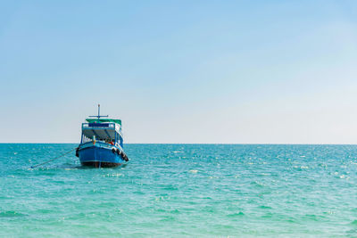 Boat in sea against clear sky