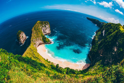 High angle view of rocks on sea shore