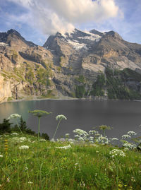 Scenic view of lake and mountains against sky