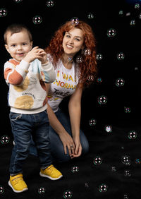 Portrait of a smiling girl with bubbles