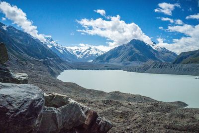 Scenic view of lake and mountains against sky