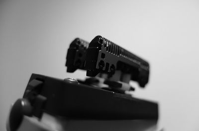 Close-up of computer keyboard on table against white background